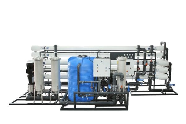 High-capacity industrial water filtration system with multiple reverse osmosis membranes, pumps, and control panels designed for efficient water purification.
