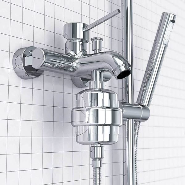 Shiny chrome bathroom mixer tap with handheld shower head and adjustable arm, mounted on white tiled wall, modern plumbing fixture for shower or bathtub.