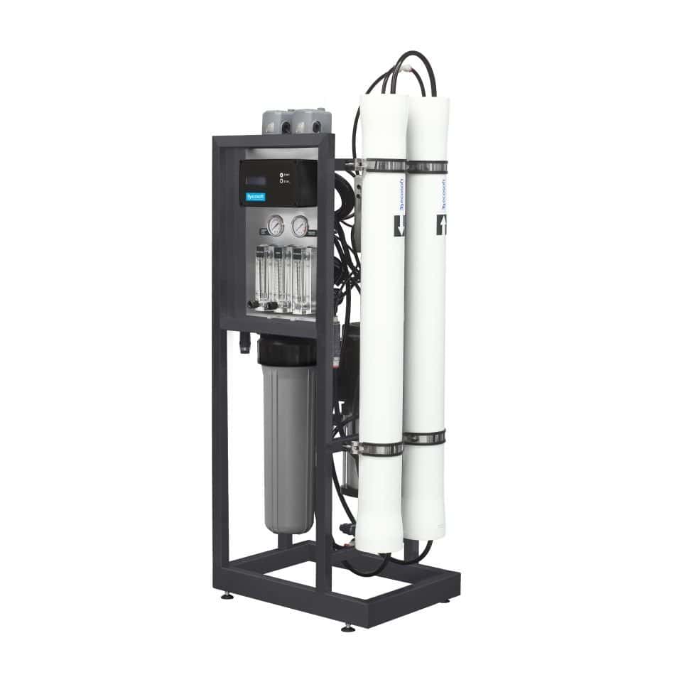 High-capacity industrial water filtration system with dual reverse osmosis membranes, gauges, and filters for pure water purification in commercial and industrial settings.